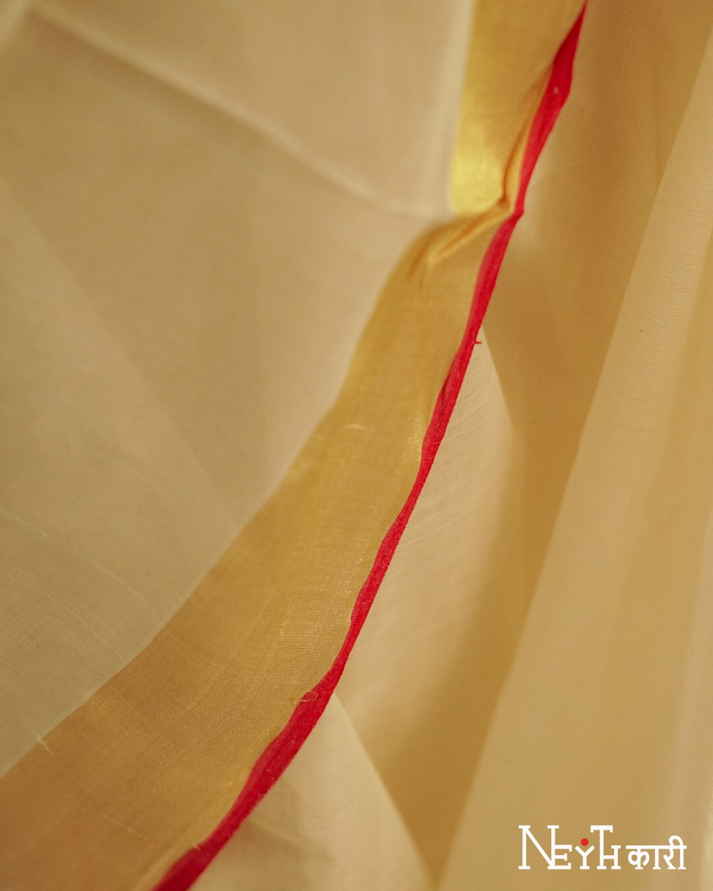 GOLDEN KASAVU WITH RED KARA BORDER