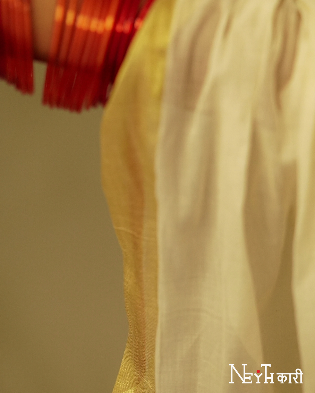 GOLDEN KASAVU WITH RED KARA BORDER 12